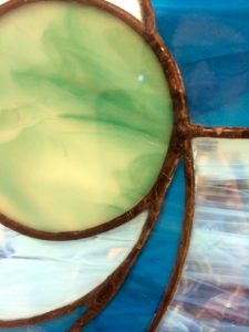 Part of a piece of art is seen. The work is Dan and Jill Burstein, New Hope, Pa. Waves of Peace, 2014, stained glass.